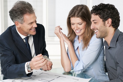 Male with Couple with Floorplan and Keys Male with Couple with Floorplan and Keys